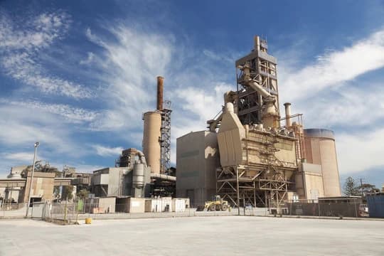 Cement plant with preheater tower and rotary kiln facilities